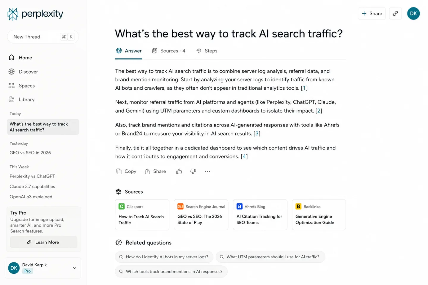Perplexity AI web interface showing an active conversation with the query 'What's the best way to track AI search traffic?'. The answer is structured as four paragraphs with inline citation markers [1] [2] [3] [4]. The Sources section below lists four cited cards: Clickport (How to Track AI Search Traffic), Search Engine Journal (GEO vs SEO: The 2026 State of Play), Ahrefs Blog (AI Citation Tracking for SEO Teams), and Backlinko (Generative Engine Optimization Guide).